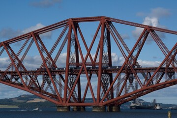 train passing huge steel bridge