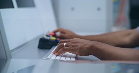 Close Up of African American Security Officer Controlling Luggage or Passenger Scanning on Computer...