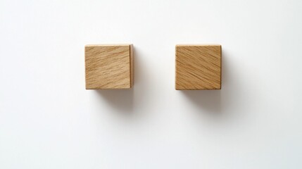 Two Wooden Blocks on a White Surface with Soft Shadows