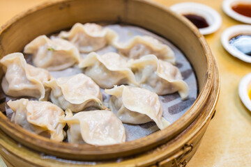  Freshly steamed pork dumplings on serving tray
