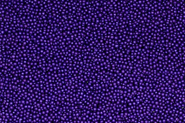Vibrant Purple Sugar Sprinkles Background: Macro Photography of Decorative Candy Pearls Used for...