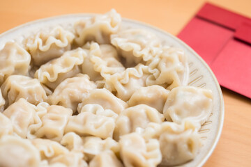 Chinese dumplings and red packet for new year