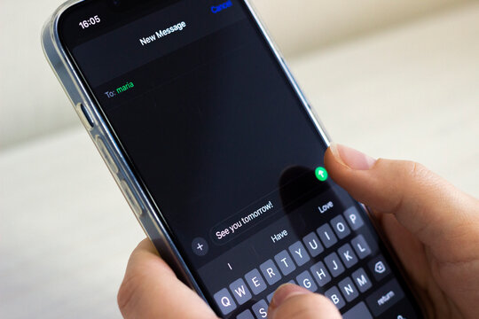 'See you tomorrow!' message on the screen of the phone (night mode), isolated