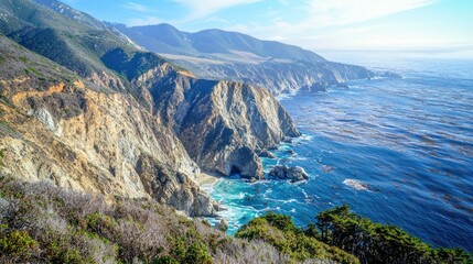 Fototapeta premium A towering cliff face, eroded by wind and water, overlooking a vast ocean with rugged terrain in the foreground.