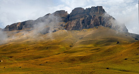 Russia. The Elbrus region. The high mountain peaks of the North Caucasus are surrounded by morning...