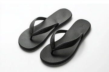 A minimalist pair of black flip-flops lying side by side on a white background