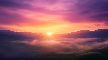Obraz premium Vibrant sunrise over misty mountains, painting the sky in shades of purple and pink.