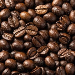 Naklejka premium A close-up of coffee beans scattered on a white background.