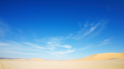 Fototapeta premium Vast Desert Landscape Under a Blue Sky