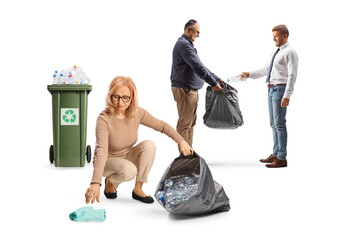 Woman picking up plastic bottles from the ground and men recycling