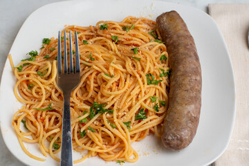spaghetti top with parmesan cheese and parsley