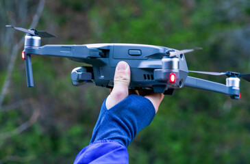 drone in hand, ready to land