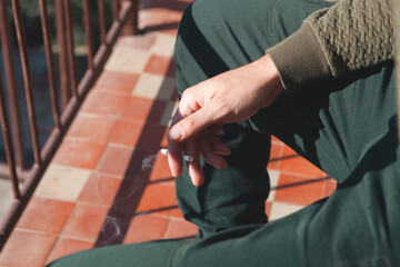 a man in a cigarette with a cigarette in hand