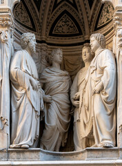 Fototapeta premium The group of the Four Crowned Saints and are Casorio, Claudio, Sempronio and Nicostrato, 1409 - 1417 by Nanni di Banco in the external niches of the church of Orsanmichele in Florence, Italy.