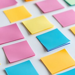 Fototapeta premium Colorful Sticky Notes Arranged on White Desk