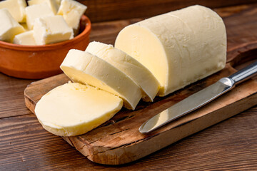 Butter that adds flavor to meals and is for breakfast on a wooden background