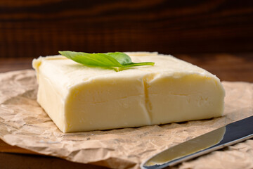 Butter that adds flavor to meals and is for breakfast on a wooden background
