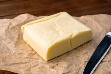 Butter that adds flavor to meals and is for breakfast on a wooden background