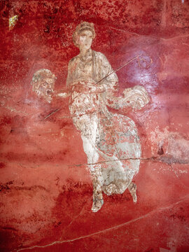 fresco of a woman from the Roman period on a red background, Pompeii 79 AD