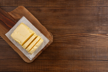 Butter that adds flavor to meals and is for breakfast on a wooden background