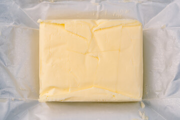 Cooking or breakfast package butter on vintage white background