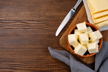 Butter that adds flavor to meals and is for breakfast on a wooden background