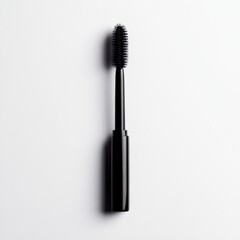 black mascara wand on a white background
