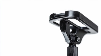 Obraz premium Black metal tripod mount detail against white background, for photography or videography