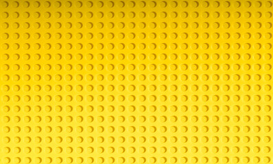 Naklejka premium Yellow background of the LEGO Classic plate