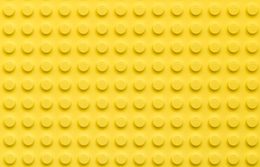 Fototapeta premium Yellow background of the LEGO Classic plate