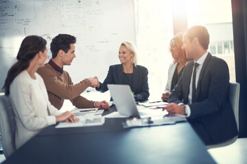 Obraz premium Business people, happy and shaking hands in office for deal, sales agreement and corporate collaboration. Investors, laptop or handshake in agency for new partnership, opportunity and team commitment