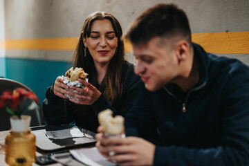 Two Friends Enjoying A Meal Together Inside a Modern Urban Restaurant