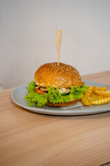 Delectable Burger with Thick Patty, Melted Cheese, and Fresh Greens Stealing the Show