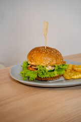 Delectable Burger with Thick Patty, Melted Cheese, and Fresh Greens Stealing the Show