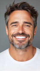 Fototapeta premium Smiling Man With Graying Hair In A Close Up Portrait