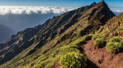 Crisp air and rugged terrain atop the mountain, with panoramic views of the surrounding wilderness.
