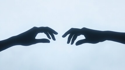 two hands reaching out to each other on a light blue background