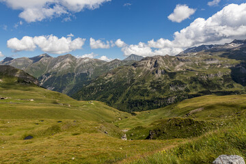 Fototapeta premium The Grossglockner mountain range with snow on the peaks and a blue sky