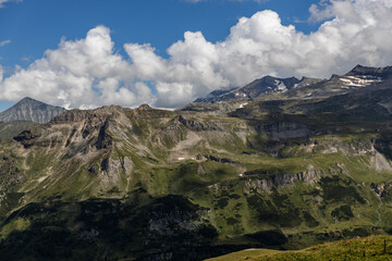 The Grossglockner mountain range with snow on the peaks and a blue sky