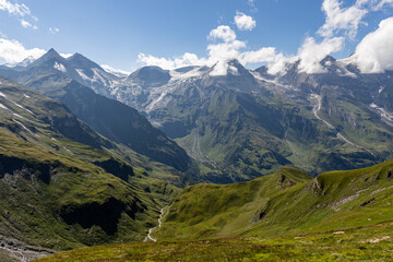 Fototapeta premium The Grossglockner mountain range with snow on the peaks and a blue sky
