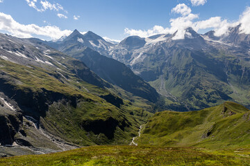 Naklejka premium The Grossglockner mountain range with snow on the peaks and a blue sky