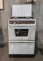 Antique, gas cooker from the 60's, white colour.