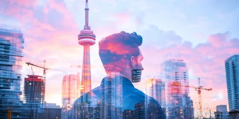 Man gazing cityscape sunset, Toronto tower