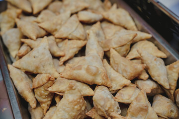Samosa is a delicious Indian appetizer made of small fried dough filled with seasoned potatoes, peas and spices. Samosa is often served with sweet or spicy chutney sauce.