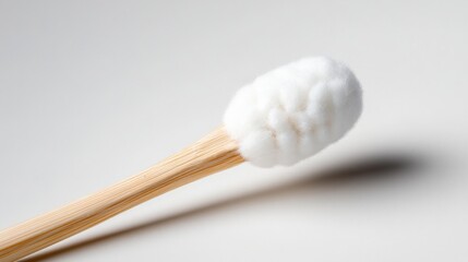 Close-up of a bamboo cotton swab on a white background