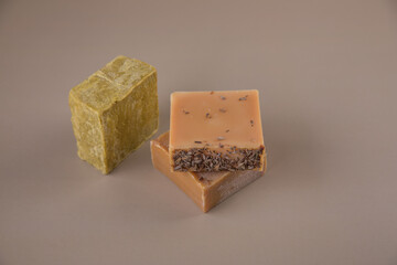 Bar soap of different colors on a uniform background