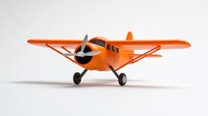 a toy orange airplane on a white background