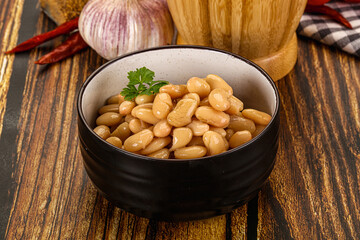 Baked white canned beans in the bowl