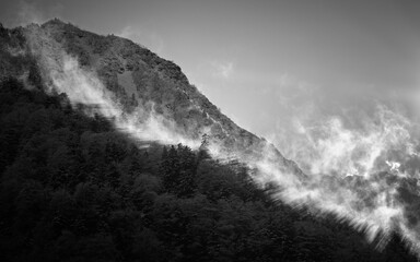 Mysterious black mountain with dramatic cloudy sky
