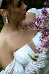close up of bride details white dress and open shoulders